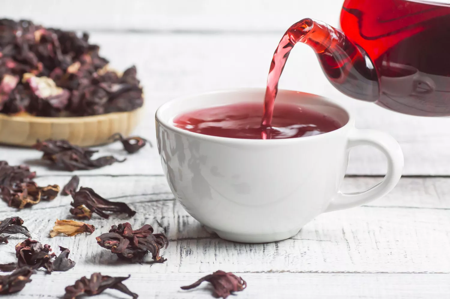 hibiscus tea pouring into white cup