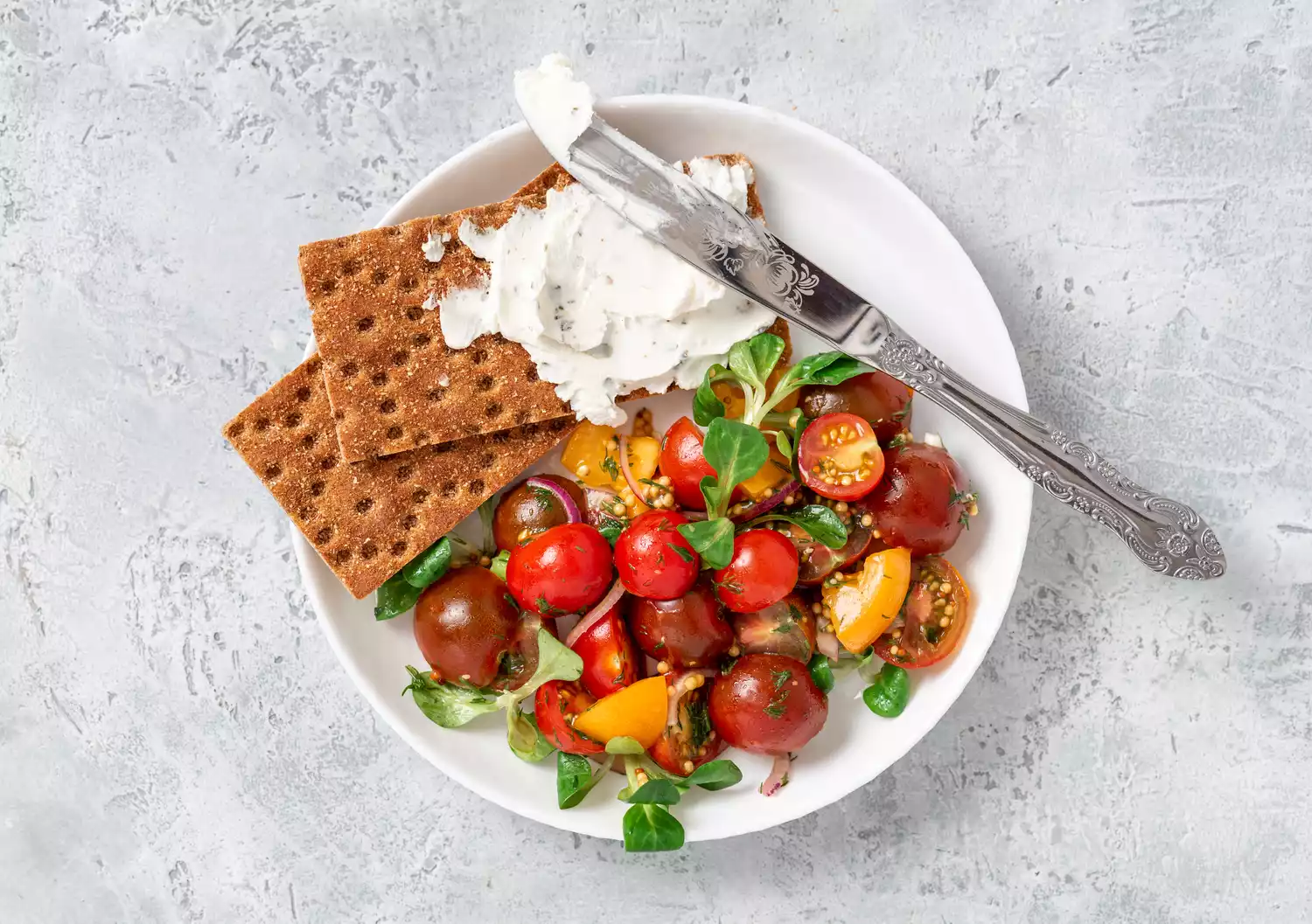 whipped feta on crackers with tomato salad